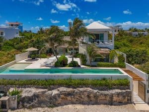 Luxurious beachfront villa with infinity pool and lush tropical gardens in Mexico. Isla Mujeres Mexico Property
