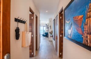 Modern hallway with nautical decor and wooden accents in a beachfront property. Isla Mujeres Mexico Property