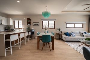 Modern open-concept living and dining area with stylish furniture and natural light.