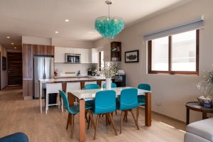 Modern dining area with bright natural light and stylish decor at Mundaca Real Estate.