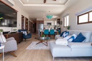 Bright modern living room with stylish furniture and large windows in a luxury property.