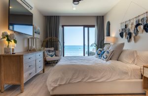 Relaxing ocean view bedroom with modern decor at Mundaca Real Estate property.
