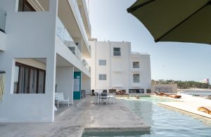 Relaxing beachfront pool at Mundaca Real Estate property in Mexico.