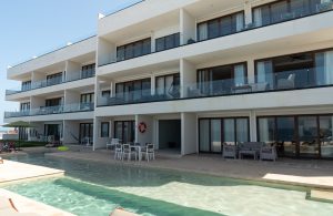 Luxury beachfront condo with pool at Mundaca Real Estate in Mexico.