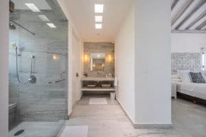 Modern bathroom with walk-in shower and double vanity in a luxury property. Isla Mujeres Mexico Property