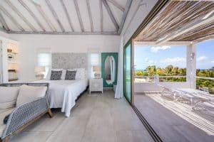 Bright bedroom with ocean view balcony in a luxury property in Mexico. Isla Mujeres Mexico Property