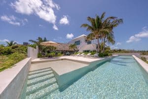 Luxurious beachfront villa with infinity pool and tropical landscaping in Mexico. Isla Mujeres Mexico Property