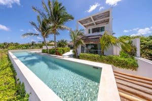Luxurious modern house with private pool and tropical landscaping in a sunny coastal setting. Isla Mujeres Mexico Property