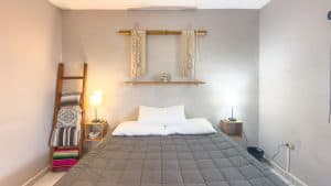 Cozy bedroom with modern decor and minimalist design in a real estate property. Isla Mujeres Mexico Property