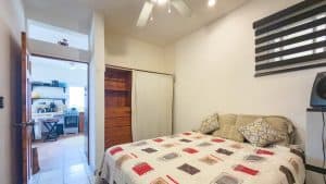 Bright bedroom with modern decor and ceiling fan in a Costa Rica property. Isla Mujeres Mexico Property
