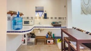 Water dispenser and kitchen appliances in a cozy home kitchen. Isla Mujeres Mexico Property