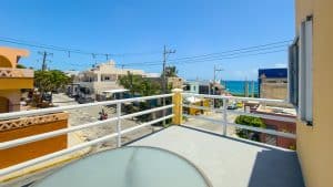 Balcony view of colorful buildings and ocean in Puerto Escondido, Oaxaca, Mexico. Isla Mujeres Mexico Property