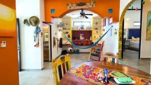 Bright and colorful interior of a Mexican-style home with vibrant decor and cozy furnishings. Isla Mujeres Mexico Property