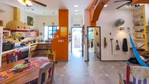 Modern colorful kitchen and dining area in a vibrant home interior. Isla Mujeres Mexico Property