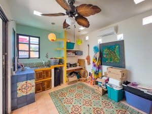 Bright, colorful interior of a tropical-themed home in Mundaca Real Estate, featuring vibrant decor. Isla Mujeres Mexico Property