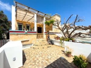 Charming beachfront house with outdoor terrace and vibrant garden in Mundaca Real Estate. Isla Mujeres Mexico Property
