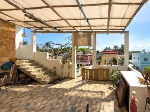Rooftop terrace with shaded pergola and city view in Múndaca Real Estate property. Isla Mujeres Mexico Property