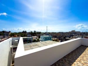 Bright cityscape view from a rooftop terrace in Mérida, Yucatán, showcasing vibrant buildings and cl. Isla Mujeres Mexico Property
